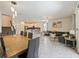 Spacious open living area with a dining table, comfortable seating, and an open kitchen, perfect for Gathering gatherings at 9084 Sommerset Hills Dr, Davenport, FL 33896
