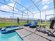 Relaxing pool area with lounge chairs and a spa, perfect for outdoor entertaining and leisure at 9084 Sommerset Hills Dr, Davenport, FL 33896