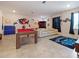 Bright game room featuring a pool table, foosball, and a ping pong table for endless fun at 9084 Sommerset Hills Dr, Davenport, FL 33896