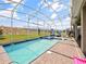 Relaxing backyard oasis featuring a sparkling pool, spa, and covered patio with comfortable lounge chairs, perfect for outdoor enjoyment at 9084 Sommerset Hills Dr, Davenport, FL 33896