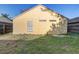 Backyard showing the back of the home with siding at 9447 Dearmont Ave, Orlando, FL 32825
