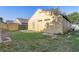 View of side and back of home showing the backyard with grass at 9447 Dearmont Ave, Orlando, FL 32825
