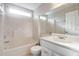 Bathroom featuring a tub and shower combination and single sink vanity at 9447 Dearmont Ave, Orlando, FL 32825
