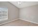 Bedroom with neutral paint, tile floors, vaulted ceiling, and natural light at 9447 Dearmont Ave, Orlando, FL 32825