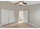 An inviting bedroom with closet space and an open doorway leading to a bathroom at 9447 Dearmont Ave, Orlando, FL 32825