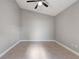 Bedroom featuring neutral paint, tile floors, vaulted ceiling, and ceiling fan at 9447 Dearmont Ave, Orlando, FL 32825