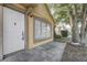 Inviting front door and window showcasing a clean facade with traditional design elements at 9447 Dearmont Ave, Orlando, FL 32825