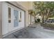 Close-up view of the front entrance featuring ornate glass doors and a well-lit, covered entryway at 9447 Dearmont Ave, Orlando, FL 32825