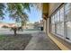 Street-level view of a yellow home with a tidy front yard and convenient driveway access at 9447 Dearmont Ave, Orlando, FL 32825