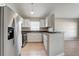 A bright kitchen showcasing stainless steel appliances, a breakfast bar, and ample cabinet space at 9447 Dearmont Ave, Orlando, FL 32825