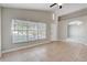 Well-lit living room showcasing tile floors, an open entryway, and a bright, airy atmosphere at 9447 Dearmont Ave, Orlando, FL 32825