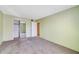 Cozy bedroom offering carpet, light walls, closet and an entry door at 1048 Plantation Dr # 12, Kissimmee, FL 34741