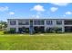 Inviting condo exterior boasting well-maintained lawns and charming architectural features at 1048 Plantation Dr # 12, Kissimmee, FL 34741