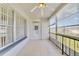 Enclosed porch with tile flooring, a ceiling fan, windows, and sliding glass doors to the outside at 1048 Plantation Dr # 12, Kissimmee, FL 34741