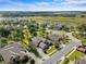 Aerial view of a neighborhood featuring large homes, lush greenery, and nearby lake at 1065 Cavan Dr, Apopka, FL 32703