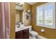 Cozy bathroom with a decorative mirror, a sink vanity, plantation shutters, and butterfly wallpaper at 1065 Cavan Dr, Apopka, FL 32703