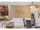 Inviting dining area featuring striped wallpaper, seating, and a glass table for cozy meals at 1065 Cavan Dr, Apopka, FL 32703
