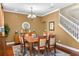 Dining room featuring hardwood floors, large table, seating for eight, and stylish decor at 1065 Cavan Dr, Apopka, FL 32703