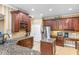 Well-appointed kitchen with granite counters, stainless steel appliances, and ample storage at 1065 Cavan Dr, Apopka, FL 32703