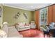 Comfortable living room showcasing hardwood floors, a piano, and neutral furniture at 1065 Cavan Dr, Apopka, FL 32703