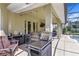 Inviting outdoor kitchen with built-in grill, TV, and bar area overlooking pool at 1065 Cavan Dr, Apopka, FL 32703