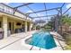 Luxurious screened-in pool and covered lanai ideal for outdoor living and entertaining at 1065 Cavan Dr, Apopka, FL 32703