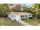 An exterior elevation of a single story home with a front yard and garage at 1150 Virginia Avenue, Altamonte Springs, FL 32701
