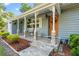 Charming front porch with stone accents, decorative columns, and a welcoming entrance at 1150 Virginia Avenue, Altamonte Springs, FL 32701