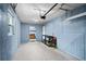Garage space with an overhead door, storage shelving, and convenient access to the home's interior at 1150 Virginia Avenue, Altamonte Springs, FL 32701