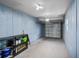 Spacious garage with ample storage space, an overhead door, and neutral colored walls at 1150 Virginia Avenue, Altamonte Springs, FL 32701