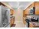 Bright kitchen with stainless steel appliances, wooden cabinets, and lots of counter space at 1150 Virginia Avenue, Altamonte Springs, FL 32701