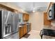 Bright kitchen with stainless steel appliances, wooden cabinets, and lots of counter space at 1150 Virginia Avenue, Altamonte Springs, FL 32701