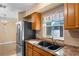 Spacious kitchen sink with plenty of cabinet space and stainless steel refrigerator at 1150 Virginia Avenue, Altamonte Springs, FL 32701