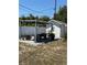 Relaxing backyard with a pergola sitting area and shed great for gardening at 1180 Baton Dr, Deltona, FL 32725