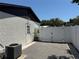 Backyard with a white fence and a door, providing privacy and security at 1180 Baton Dr, Deltona, FL 32725