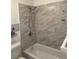 Bathroom featuring tiled shower and tub at 1180 Baton Dr, Deltona, FL 32725