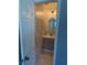 A remodeled bathroom features a gray vanity and marble-look tile in this cozy space at 1180 Baton Dr, Deltona, FL 32725