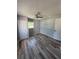 This bedroom features light gray walls, a window to the outside, a ceiling fan, and a closet at 1180 Baton Dr, Deltona, FL 32725