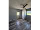 Bedroom with ceiling fan, direct access to backyard, and closet at 1180 Baton Dr, Deltona, FL 32725