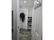 Well-organized walk-in closet with shelving, hanging rack, and space for shoes at 1180 Baton Dr, Deltona, FL 32725
