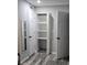 Walk-in closet featuring built-in shelving and clothing storage at 1180 Baton Dr, Deltona, FL 32725