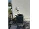 Exterior of the home featuring the air conditioning unit and a stucco wall at 1180 Baton Dr, Deltona, FL 32725