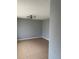 Spacious living room with tile floors and modern lighting fixture, perfect for relaxation at 1180 Baton Dr, Deltona, FL 32725