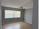 Bright living room featuring tile floors and a window that offers ample natural light at 1180 Baton Dr, Deltona, FL 32725