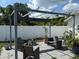 Backyard patio with stylish outdoor furniture and a pergola at 1180 Baton Dr, Deltona, FL 32725