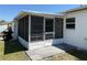 Enclosed porch featuring screen windows offering natural light and ventilation at 1180 Baton Dr, Deltona, FL 32725