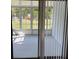 Enclosed sunroom offering a view of the backyard and access to natural light at 1180 Baton Dr, Deltona, FL 32725