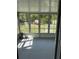 Bright sunroom with a full wall of windows offering backyard views and natural light at 1180 Baton Dr, Deltona, FL 32725