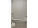 Clean and bright full bathroom featuring a tub and shower combination with white tile surround at 1235 Island Slough Ln, Davenport, FL 33837