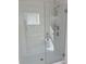 Modern bathroom featuring glass shower with sleek fixtures and bright white tile at 1235 Island Slough Ln, Davenport, FL 33837